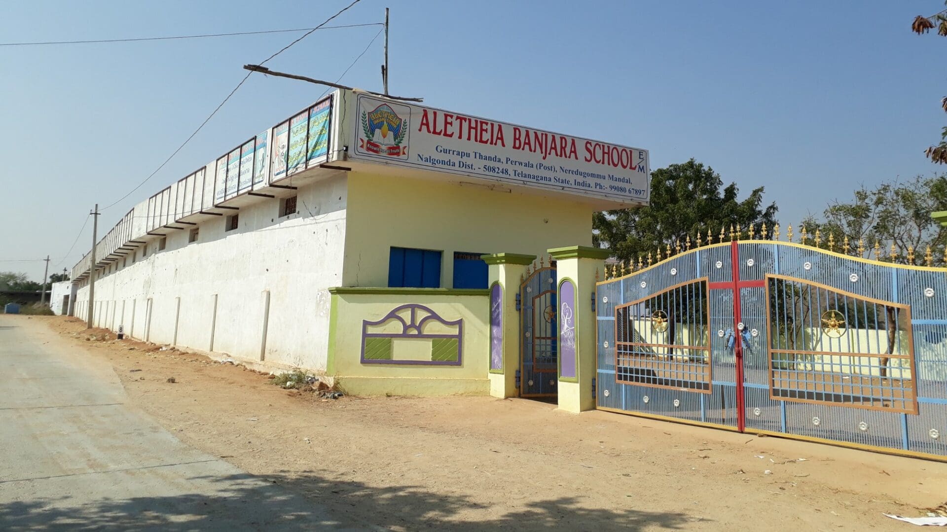 A building with a fence and sign on it