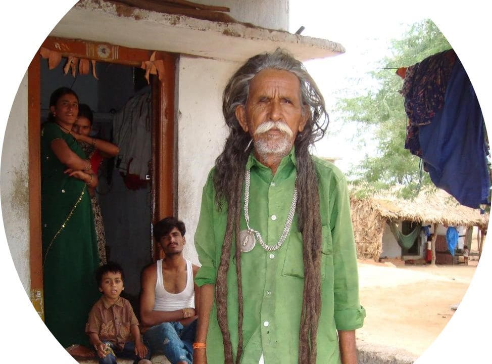 A man with long hair and a mustache.