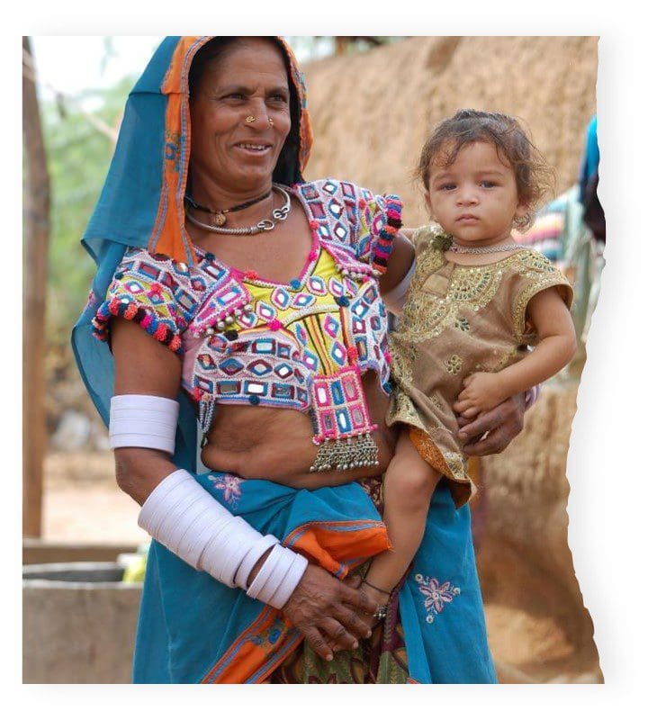 A woman and child in traditional clothing.