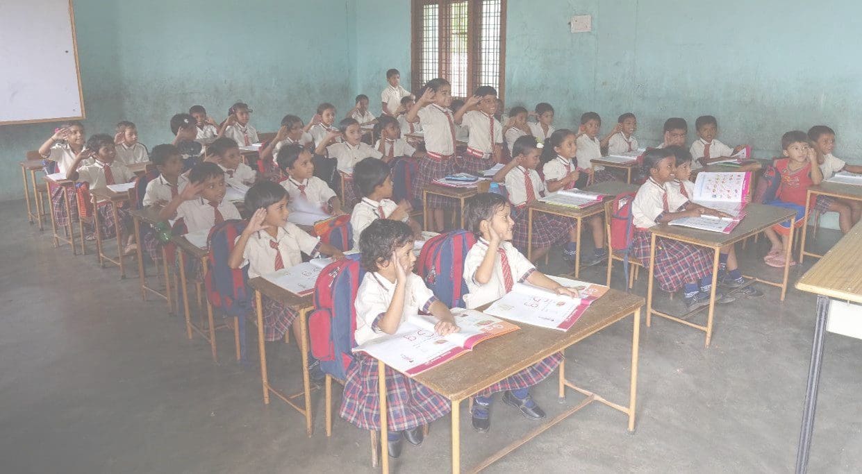 A classroom full of students sitting at desks.