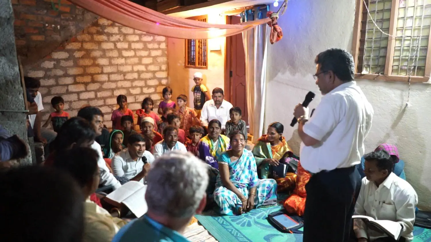 A group of people sitting in front of an audience.