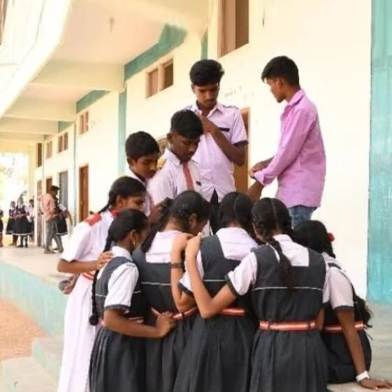 A group of people standing around each other.