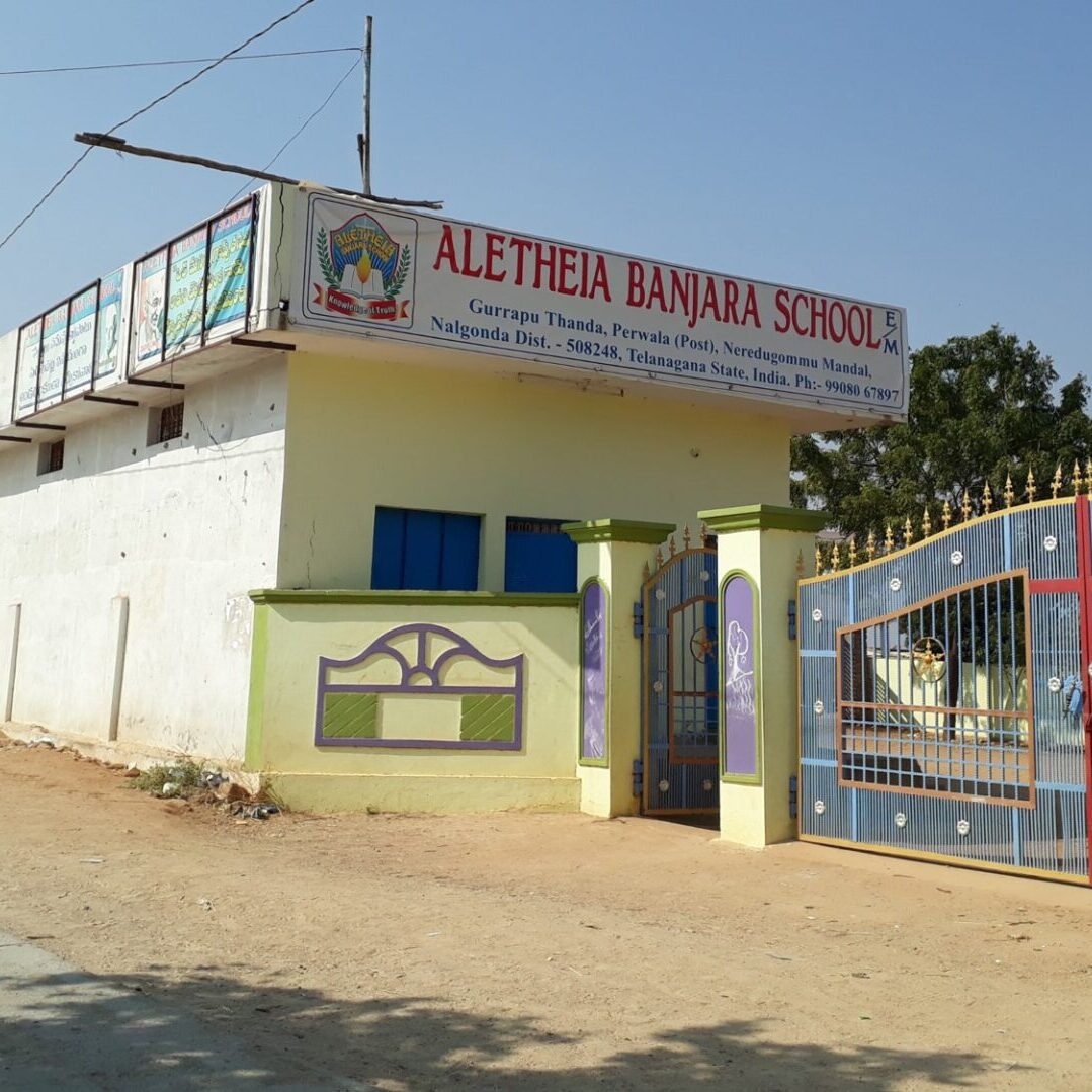 A building with a fence and sign on it